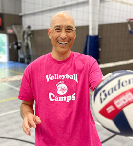 volleyball coach chijo in gym smiling